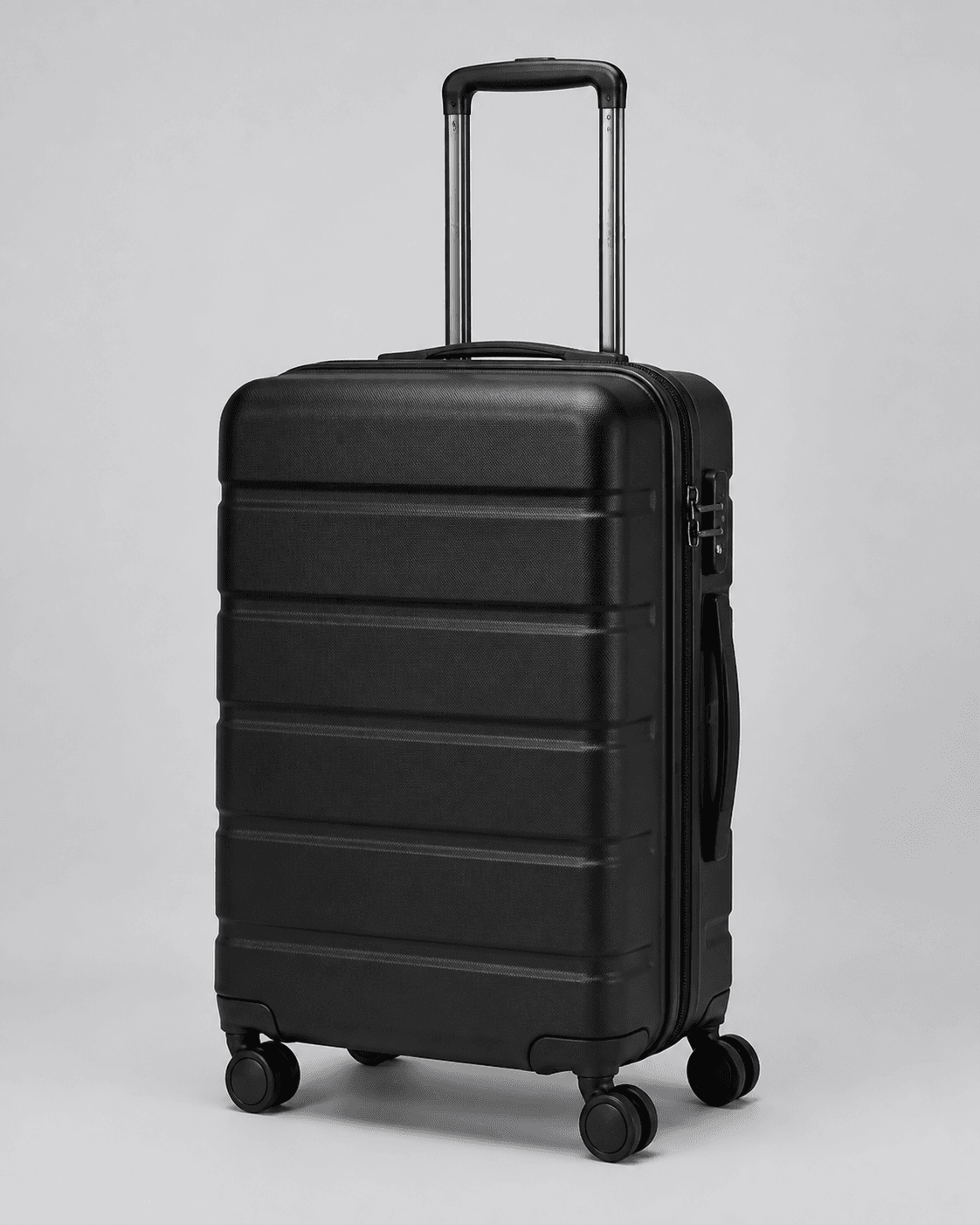 Closed black hard-shell spinner carry-on with shell ribs, telescoping handle, side handle, zipper edge, lock hardware, and wheel assemblies on a neutral background